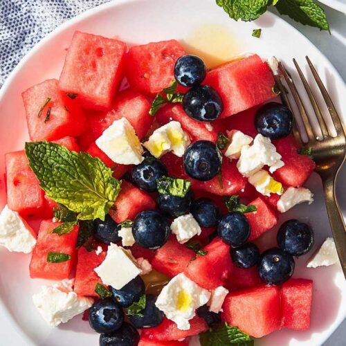 Watermelon Blueberry and Feta Cheese Salad – A Refreshing Summer Delight 6 Fresh Watermelon Blueberry and Feta Cheese Salad with mint garnish.