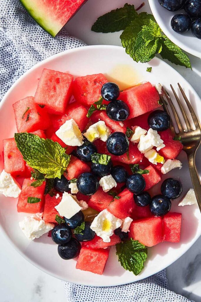 Watermelon Blueberry and Feta Cheese Salad – A Refreshing Summer Delight 4 Fresh Watermelon Blueberry and Feta Cheese Salad with mint garnish.