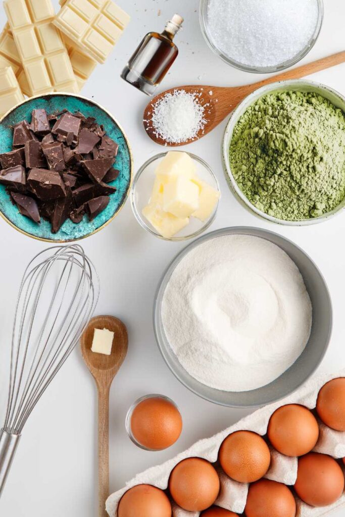 Matcha Brownies – The Perfect Fusion of Green Tea and Chocolate 2 Ingredients for matcha brownies laid out on a marble surface