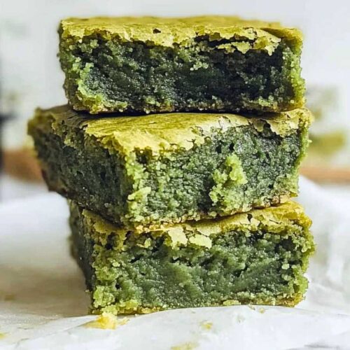Matcha Brownies – The Perfect Fusion of Green Tea and Chocolate 5 Stacked matcha brownies with a vibrant green color and a fudgy, moist texture.