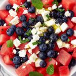 Fresh Watermelon Blueberry and Feta Cheese Salad with mint and olive oil.