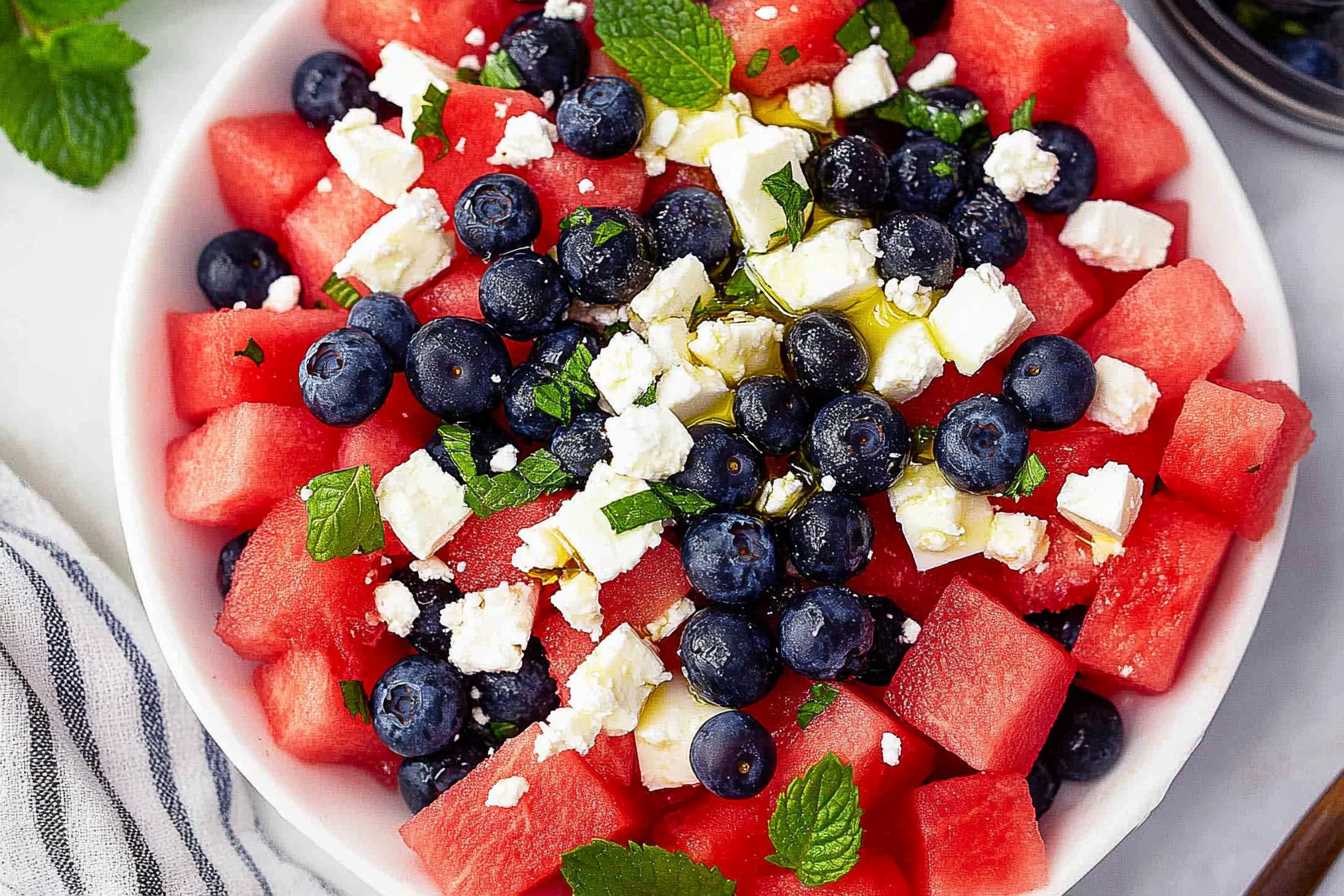 Fresh Watermelon Blueberry and Feta Cheese Salad with mint and olive oil.